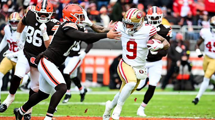 Nov 30, 2025; Cleveland, Ohio, USA;  San Francisco 49ers wide receiver Skyy Moore (9) runs the ball as Cleveland Browns tight end Blake Whiteheart (86) defends during the first half at Huntington Bank Field. Mandatory Credit: Ken Blaze-Imagn Images
