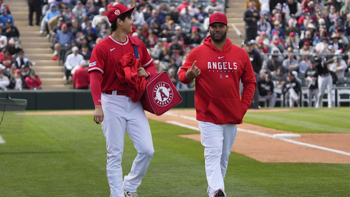 Feb 26, 2023; Tempe, Arizona, USA; Los Angeles Angels starting pitcher Shohei Ohtani (17) and Albert Pujols leave the game together in the fourth inning against the Chicago White Soxat Tempe Diablo Stadium. Mandatory Credit: Rick Scuteri-Imagn Images Feb 26, 2023; Tempe, Arizona, USA; Los Angeles Angels starting pitcher Shohei Ohtani (17) and Albert Pujols leave the game together in the fourth inning against the Chicago White Soxat Tempe Diablo Stadium. Mandatory Credit: Rick Scuteri-Imagn Images