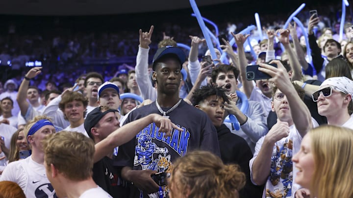 Mar 1, 2025; Provo, Utah, USA; Brigham Young Cougars 2025/-2026 top recruit Aj Dybantsa joins the student section during the second half of the game against the West Virginia Mountaineers at Marriott Center. Mandatory Credit: Rob Gray-Imagn Images