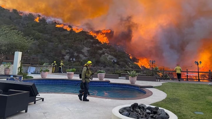 A fire in Pacific Palisades has created chaos in Los Angeles, Calif. forcing residents to evacuate the area while heavy winds blow. d