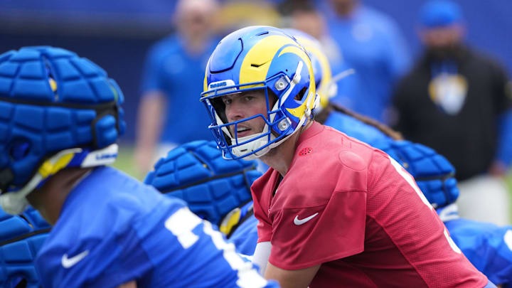 May 28, 2025; Woodland Hills, CA, USA; Los Angeles Rams quarterback Matthew Stafford (9) prepares to take the snap during organized team activities at Rams Practice Facility. Mandatory Credit: Kirby Lee-Imagn Images