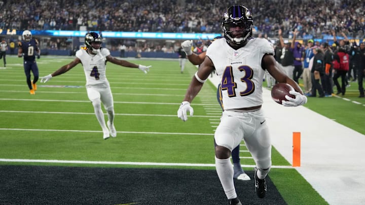 Nov 25, 2024; Inglewood, California, USA; Baltimore Ravens running back Justice Hill (43) scores on a 51-yard touchdown run in the fourth quarter against the Los Angeles Chargers at SoFi Stadium. Mandatory Credit: Kirby Lee-Imagn Images