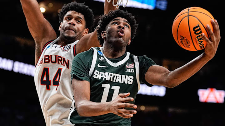 Michigan State guard Jase Richardson (11) goes to the basket against Auburn center Dylan Cardwell (44) during the second half of the Elite Eight round of NCAA tournament at State Farm Arena in Atlanta, Ga. on Sunday, March 30, 2025. Michigan State guard Jase Richardson (11) goes to the basket against Auburn center Dylan Cardwell (44) during the second half of the Elite Eight round of NCAA tournament at State Farm Arena in Atlanta, Ga. on Sunday, March 30, 2025.