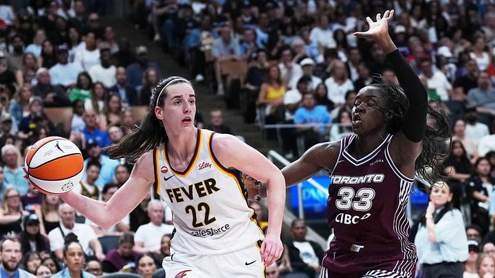 Aug 18, 2026; Toronto, Ontario, CAN; Indiana Fever guard Caitlin Clark (22) controls the ball as Toronto Tempo forward Ornella Bankole (33) tries to defend during the fourth quarter at Scotiabank Arena. Mandatory Credit: Nick Turchiaro-Imagn Images Aug 18, 2026; Toronto, Ontario, CAN; Indiana Fever guard Caitlin Clark (22) controls the ball as Toronto Tempo forward Ornella Bankole (33) tries to defend during the fourth quarter at Scotiabank Arena. Mandatory Credit: Nick Turchiaro-Imagn Images
