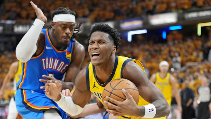 Jun 13, 2025; Indianapolis, Indiana, USA; Indiana Pacers guard Bennedict Mathurin (00) falls while defended by Oklahoma City Thunder guard Luguentz Dort (5) during the second half during game four of the 2025 NBA Finals at Gainbridge Fieldhouse. Mandatory Credit: Kyle Terada-Imagn Images Jun 13, 2025; Indianapolis, Indiana, USA; Indiana Pacers guard Bennedict Mathurin (00) falls while defended by Oklahoma City Thunder guard Luguentz Dort (5) during the second half during game four of the 2025 NBA Finals at Gainbridge Fieldhouse. Mandatory Credit: Kyle Terada-Imagn Images