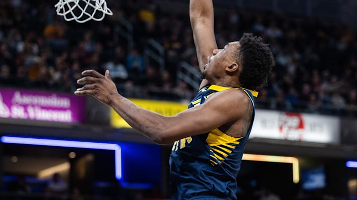Feb 11, 2025; Indianapolis, Indiana, USA: Indiana Pacers center Thomas Bryant (3) shoots the ball while New York Knicks guard Landry Shamet (44) defends in the first half at Gainbridge Fieldhouse. Mandatory Credit: Trevor Ruszkowski-Imagn Images