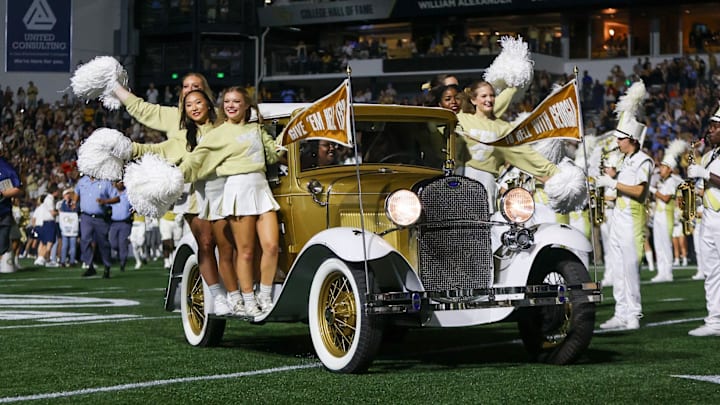 Oct 28, 2023; Atlanta, Georgia, USA; Georgia Tech Yellow Jackets cheerleaders ride on the Ramblin' Wreck car before a game against the North Carolina Tar Heels at Bobby Dodd Stadium at Hyundai Field. Mandatory Credit: Brett Davis-USA TODAY Sports