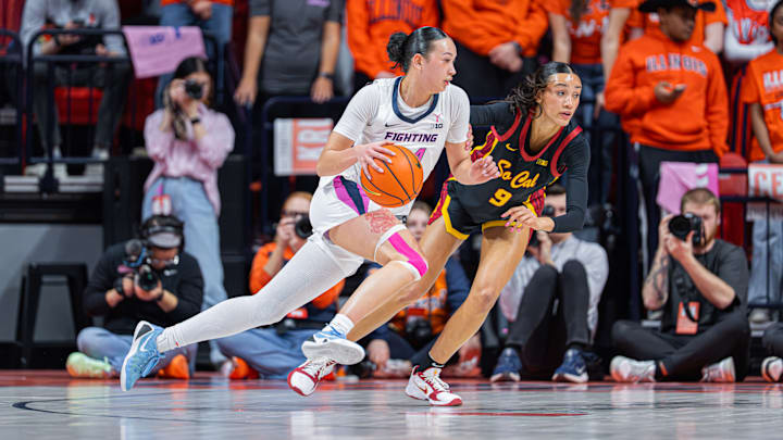 Illinois guard Maddie Webber drives on USC guard Jazzy Davidson (9) in the Illini's 70-62 loss to the Trojans on Sunday at the State Farm Center in Champaign, Illinois.