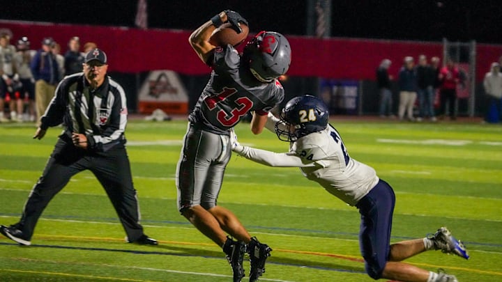 Junior receiver Jake Anzivino (13) makes the catch for Cranston West football during the 2025 season.