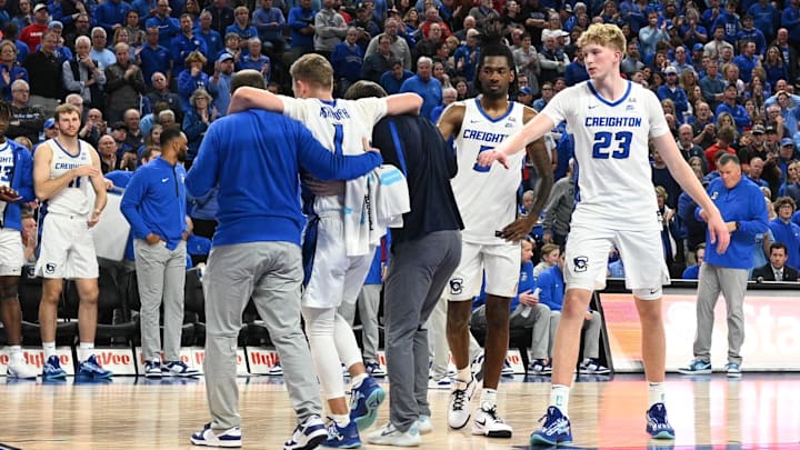 Nov 22, 2024; Omaha, Nebraska, USA; Creighton Bluejays guard Steven Ashworth (1) is helped off the court against the Nebraska Cornhuskers during the second half at CHI Health Center Omaha