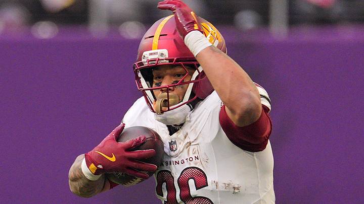 Dec 7, 2025; Minneapolis, Minnesota, USA; Washington Commanders running back Chris Rodriguez Jr. (36) rushes the ball against the Minnesota Vikings during the second half at U.S. Bank Stadium. 