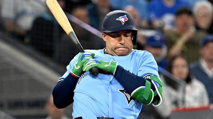 Mar 31, 2026; Toronto, Ontario, CAN; Toronto Blue Jays designated hitter George Springer (4) reacts to a high inside pitch from Colorado Rockies relief pitcher Juan Mejia in the fifth inning at Rogers Centre. Mandatory Credit: Dan Hamilton-Imagn Images