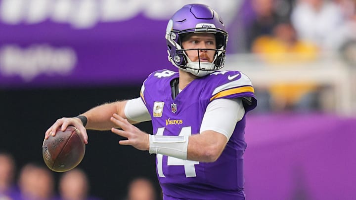 Dec 1, 2024; Minneapolis, Minnesota, USA; Minnesota Vikings quarterback Sam Darnold (14) passes against the Arizona Cardinals in the second quarter at U.S. Bank Stadium. Mandatory Credit: Brad Rempel-Imagn Images