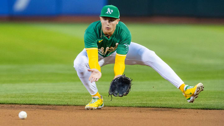Sep 20, 2024; Oakland, California, USA; Oakland Athletics second base Zack Gelof (20) fields a grounder during the third inning against the New York Yankees at Oakland-Alameda County Coliseum. Mandatory Credit: Bob Kupbens-Imagn Images
