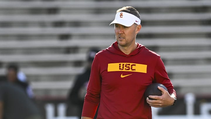 Oct 19, 2024; College Park, Maryland, USA;  Southern California Trojans head coach Lincoln Riley stands on the field before the game against the Maryland Terrapins at SECU Stadium. Mandatory Credit: Tommy Gilligan-Imagn Images