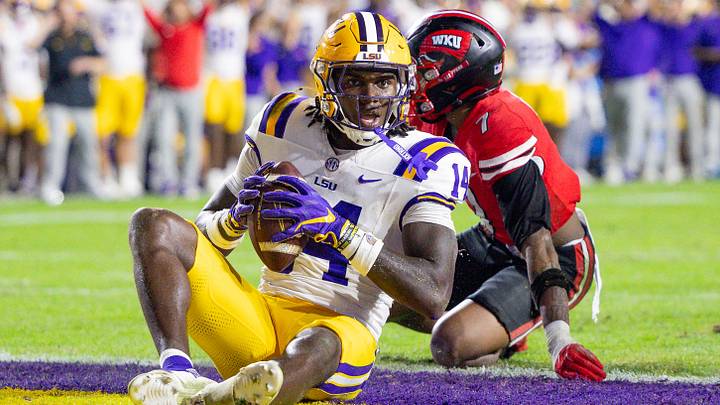 Trey'Dez Green sits in the end zone after scoring a touchdown in 2025