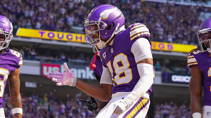 Sep 22, 2024; Minneapolis, Minnesota, USA; Minnesota Vikings wide receiver Justin Jefferson (18) celebrates his touchdown against the Houston Texans in the first quarter at U.S. Bank Stadium. Mandatory Credit: Brad Rempel-Imagn Images