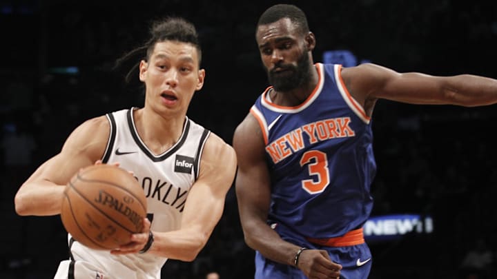 Oct 8, 2017; Brooklyn, NY, USA; Brooklyn Nets guard Jeremy Lin (7) passes the ball against New York Knicks guard Tim Hardaway Jr. (3) in the third quarter at Barclays Center. Nets win 117-83. Mandatory Credit: Nicole Sweet-Imagn Images