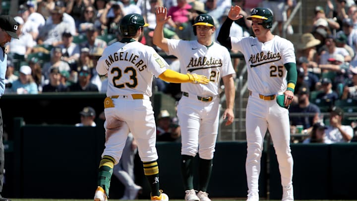 May 10, 2025; West Sacramento, California, USA; Athletics designated hitter Shea Langeliers (23) celebrates with Tyler Soderstrom (21) and Jacob Wilson (5) after hitting a three run home run against the New York Yankees during the seventh inning at Sutter Health Park. Mandatory Credit: Dennis Lee-Imagn Images
