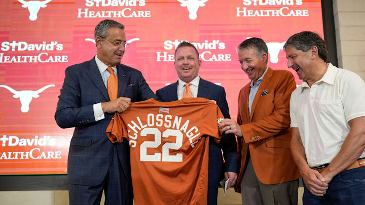 University of Texas baseball coach Jim Schlossnagle, second from left, is joined by UT Athletic Director Chris Del Conte, left to right, President Jay Hartzell and Chairman of the Board of Regents Kevin Eltife at his introductory news conference at the Frank Denius Family University Hall of Fame Wednesday June 26, 2024.