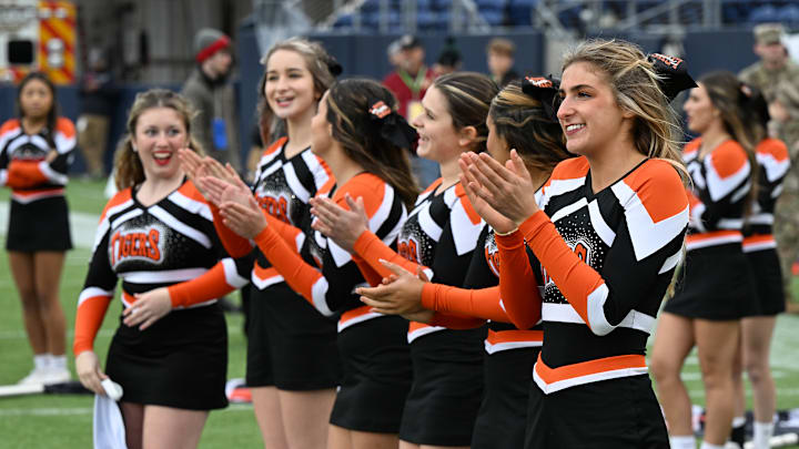 Liberty Center cheerleaders cheer for the Tigers prior to the 2023 OHSAA Division V state championship game at Tom Benson Hall of Fame Stadium in Canton. 