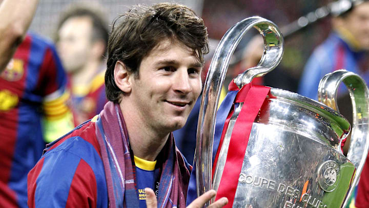 May 28, 2011; London, ENGLAND; FC Barcelona player Lionel Messi celebrates with the trophy after defeating Manchester United 3-1 in the 2011 UEFA Champions League final at Wembley Stadium. Mandatory Credit: Walter Luger/GEPA via Imagn Images