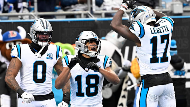 Dec 15, 2024; Charlotte, North Carolina, USA; Carolina Panthers wide receiver Jalen Coker (18) celebrates with tight end Ja'Tavion Sanders (0) and wide receiver Xavier Legette (17) after scoring a touchdown in the second quarter at Bank of America Stadium. Mandatory Credit: Bob Donnan-Imagn Images