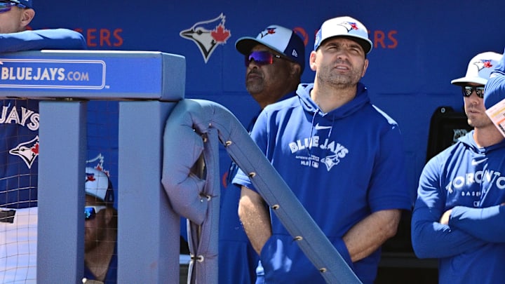 Joey Votto is pictured in the Blue Jays dugout during a Spring Training game against the Baltimore Orioles.