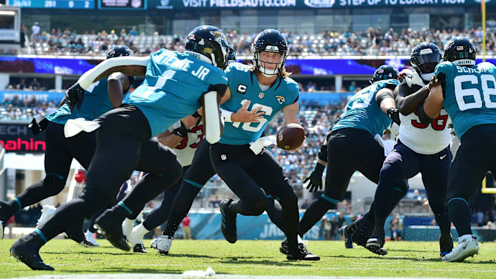Jacksonville Jaguars quarterback Trevor Lawrence (16) hands off to running back Travis Etienne Jr. (1) during first quarter action. The Jacksonville Jaguars hosted the Houston Texans at TIAA Bank Field in Jacksonville, FL Sunday, October 9, 2022. [Bob Self/Florida Times-Union