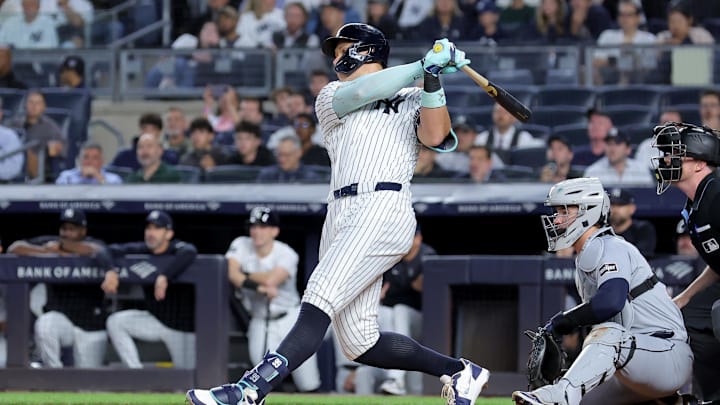 Sep 9, 2025; Bronx, New York, USA; New York Yankees right fielder Aaron Judge (99) follows through on a solo home run against the Detroit Tigers during the first inning at Yankee Stadium. Mandatory Credit: Brad Penner-Imagn Images