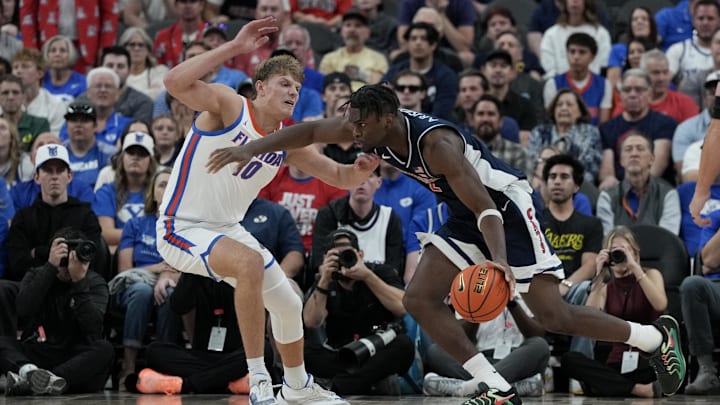 Nov 3, 2025; Las Vegas, NV, USA; Florida Gators forward Thomas Haugh (10) defends Arizona Wildcats guard Dwayne Aristode (2) in the first half of the Hall of Fame Series game at T-Mobile Arena. Mandatory Credit: Candice Ward-Imagn Images Nov 3, 2025; Las Vegas, NV, USA; Florida Gators forward Thomas Haugh (10) defends Arizona Wildcats guard Dwayne Aristode (2) in the first half of the Hall of Fame Series game at T-Mobile Arena. Mandatory Credit: Candice Ward-Imagn Images