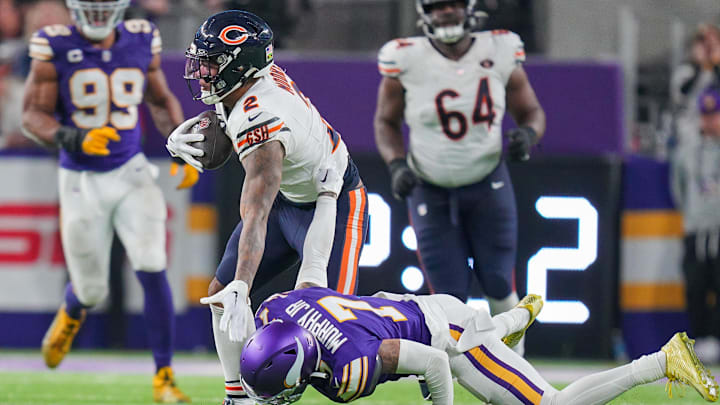 DJ Moore tries to dodge a tackle after a reception against the Vikings.
