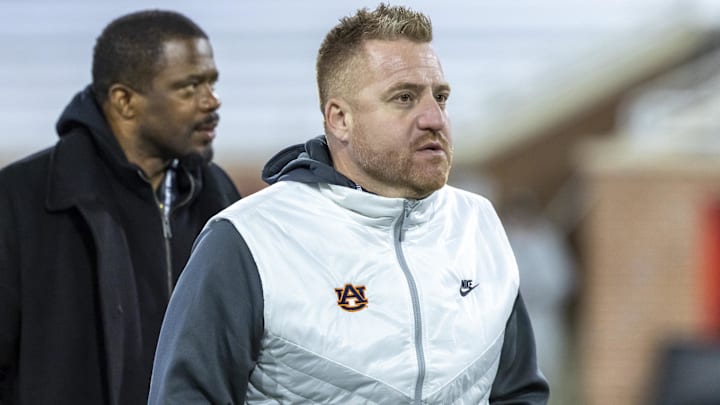 Jan 28, 2026; Mobile, AL, USA; Auburn head football coach Alex Golesh visits the field during American Senior Bowl practice at Hancock Whitney Stadium. Mandatory Credit: Vasha Hunt-Imagn Images