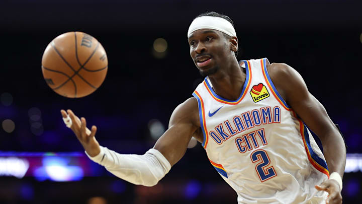 Oklahoma City Thunder guard Shai Gilgeous-Alexander passes the ball against the Philadelphia 76ers. Oklahoma City Thunder guard Shai Gilgeous-Alexander passes the ball against the Philadelphia 76ers.