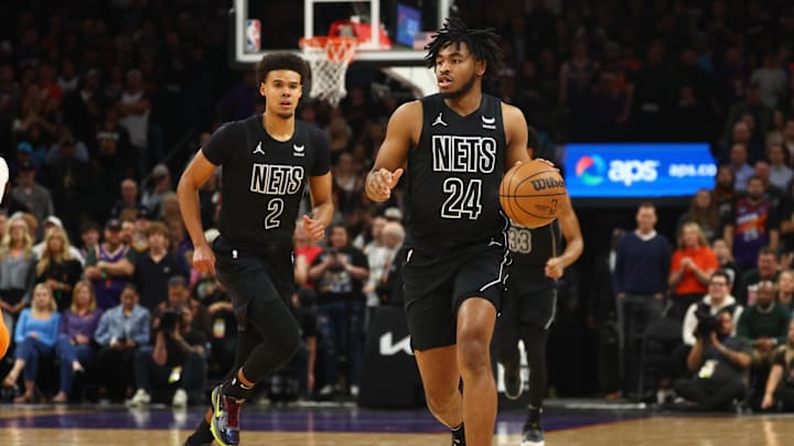 Dec 13, 2023; Phoenix, Arizona, USA; Brooklyn Nets guard Cam Thomas (24) and forward Cameron Johnson (2) against the Phoenix Suns at Footprint Center. Mandatory Credit: Mark J. Rebilas-Imagn Images