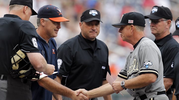 Virginia Cavaliers head coach Brian O'Connor (left) shakes hands with Vanderbilt Commodores head coach Tim Corbin (right) before the game in game two of the College World Series Finals at TD Ameritrade Park. Virginia Cavaliers head coach Brian O'Connor (left) shakes hands with Vanderbilt Commodores head coach Tim Corbin (right) before the game in game two of the College World Series Finals at TD Ameritrade Park.