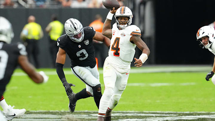 Sep 29, 2024; Paradise, Nevada, USA; Cleveland Browns quarterback Deshaun Watson (4) throws under pressure against Las Vegas Raiders defensive end Tyree Wilson (9) during the second quarter at Allegiant Stadium. Mandatory Credit: Stephen R. Sylvanie-Imagn Images