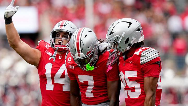 Ohio State Buckeyes linebacker Christian Alliegro (14), cornerback Jermaine Mathews Jr. (7) and cornerback Jay Timmons (25) celebrate in the second half of the NCAA football game at Ohio Stadium on Sept. 5, 2026 in Columbus, Ohio.