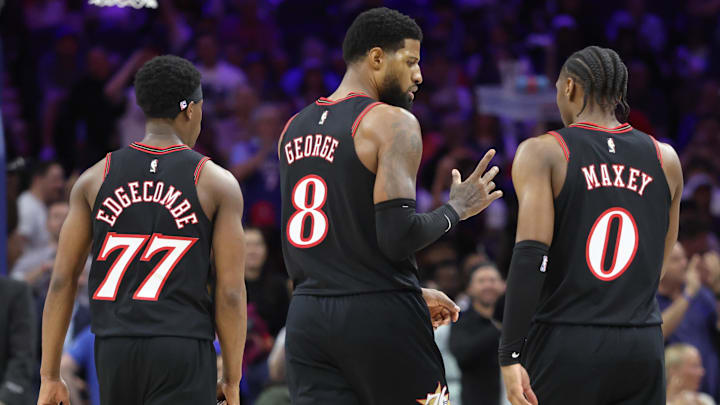 Apr 15, 2026; Philadelphia, Pennsylvania, USA; Philadelphia 76ers forward Paul George (8) talks with guard Tyrese Maxey (0) and guard Vj Edgecombe (77) during a break in action against the Orlando Magic in the third quarter of a play-in round of the 2026 NBA Playoffs at Xfinity Mobile Arena. Mandatory Credit: Bill Streicher-Imagn Images Apr 15, 2026; Philadelphia, Pennsylvania, USA; Philadelphia 76ers forward Paul George (8) talks with guard Tyrese Maxey (0) and guard Vj Edgecombe (77) during a break in action against the Orlando Magic in the third quarter of a play-in round of the 2026 NBA Playoffs at Xfinity Mobile Arena. Mandatory Credit: Bill Streicher-Imagn Images