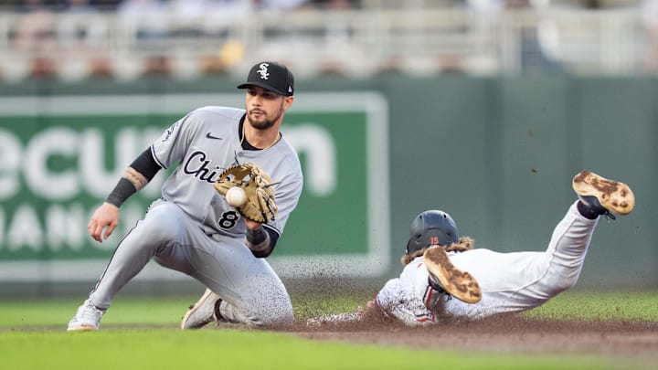 Apr 23, 2025; Minneapolis, Minnesota, USA; The throw to Chicago White Sox shortstop Jacob Amaya (8) is late as Minnesota Twins second base Luke Keaschall (15) slides safe into second base in the third inning at Target Field. Mandatory Credit: Matt Blewett-Imagn Images