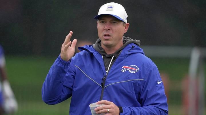 Bills defense coordinator Jim Leonhard talks to someone on the sidelines before practice at Bills Training Camp. Bills defense coordinator Jim Leonhard talks to someone on the sidelines before practice at Bills Training Camp.