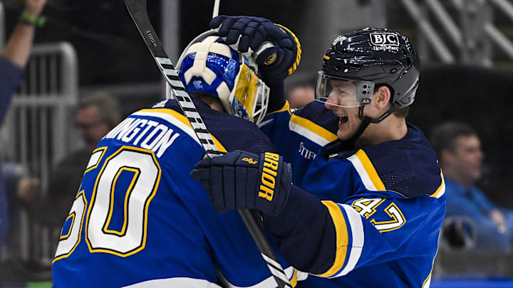 Mar 28, 2024; St. Louis, Missouri, USA;  St. Louis Blues defenseman Torey Krug (47) celebrates with Jordan Binnington (50)