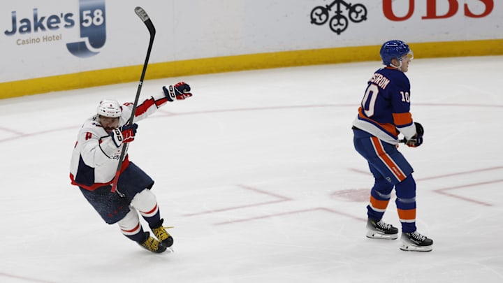 Apr 6, 2025; Elmont, New York, USA;  Washington Capitals left wing Alex Ovechkin (8) scores a goal in the 2nd period against the New York Islanders at UBS Arena. The goal is the 895th of Ovechkin’s career, breaking the NHL all-time career goals record previously held by Wayne Gretzky.at UBS Arena. Mandatory Credit: Geoff Burke-Imagn Images