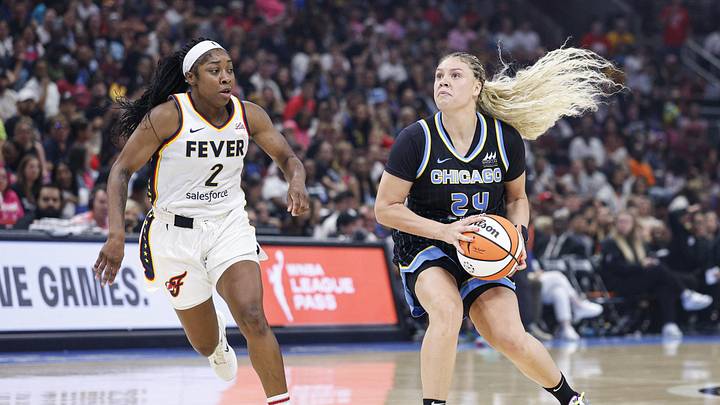 Jul 27, 2025; Chicago, Illinois, USA; Chicago Sky guard Rachel Banham (24) drives to the basket against Indiana Fever guard Aari McDonald (2) during the second half at United Center. Mandatory Credit: Kamil Krzaczynski-Imagn Images