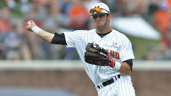 Maryland Terps shortstop Blake Schmit (1) throws to first to end the sixth inning against the Virginia Cavaliers.