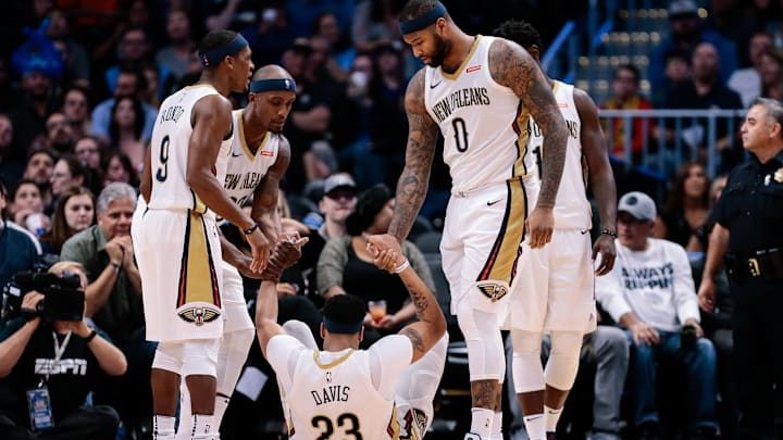 Nov 17, 2017; Denver, CO, USA; New Orleans Pelicans guard Rajon Rondo (9) and forward Dante Cunningham (33) and center DeMarcus Cousins (0) help forward Anthony Davis (23) up from the floor in the third quarter against the Denver Nuggets at the Pepsi Center. Mandatory Credit: Isaiah J. Downing-Imagn Images