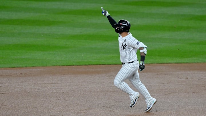 New York Yankees second baseman Gleyber Torres (25) celebrates after hitting a three-run home run during the eighth inning against the Los Angeles Dodgers in game four of the 2024 MLB World Series at Yankee Stadium. 