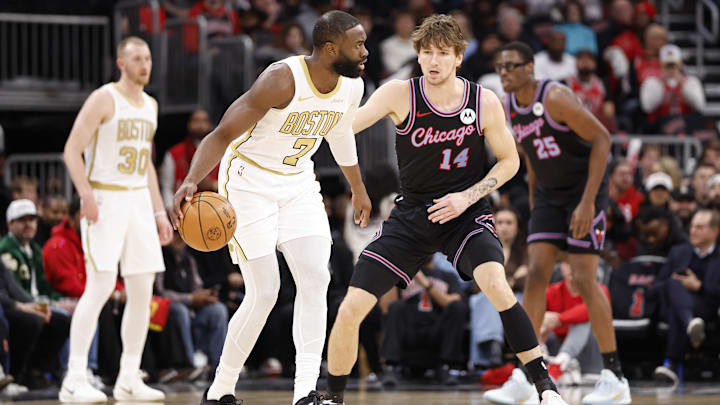 Jan 24, 2026; Chicago, Illinois, USA; Chicago Bulls forward Matas Buzelis (14) defends against Boston Celtics guard Jaylen Brown (7) during the first half at United Center. Mandatory Credit: Kamil Krzaczynski-Imagn Images