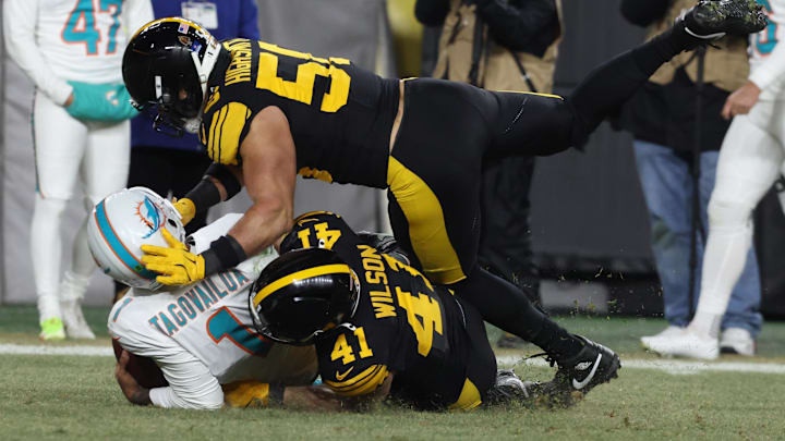 Miami Dolphins quarterback Tua Tagovailoa (1) is sacked by Pittsburgh Steelers linebacker Payton Wilson (41) and linebacker Alex Highsmith (56) in the third quarter at Acrisure Stadium. Miami Dolphins quarterback Tua Tagovailoa (1) is sacked by Pittsburgh Steelers linebacker Payton Wilson (41) and linebacker Alex Highsmith (56) in the third quarter at Acrisure Stadium.