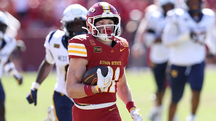 Oct 3, 2026; Ames, Iowa, USA;  Iowa State Cyclones running back Aiden Flora (21) breaks through the West Virginia Mountaineers defense for a touchdown during the second half at Jack Trice Stadium.  Mandatory Credit: Reese Strickland-Imagn Images